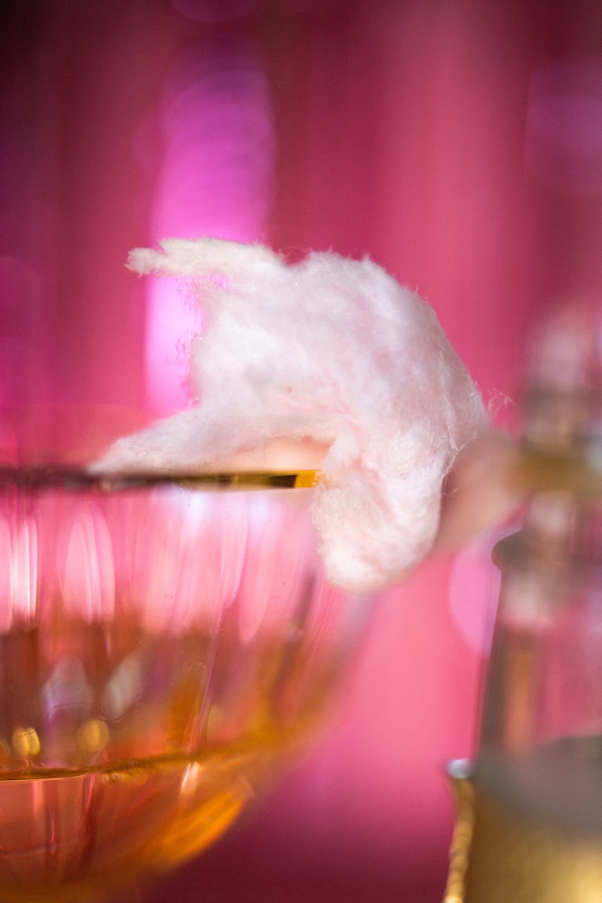 cotton candy on a wine glass with gold rim