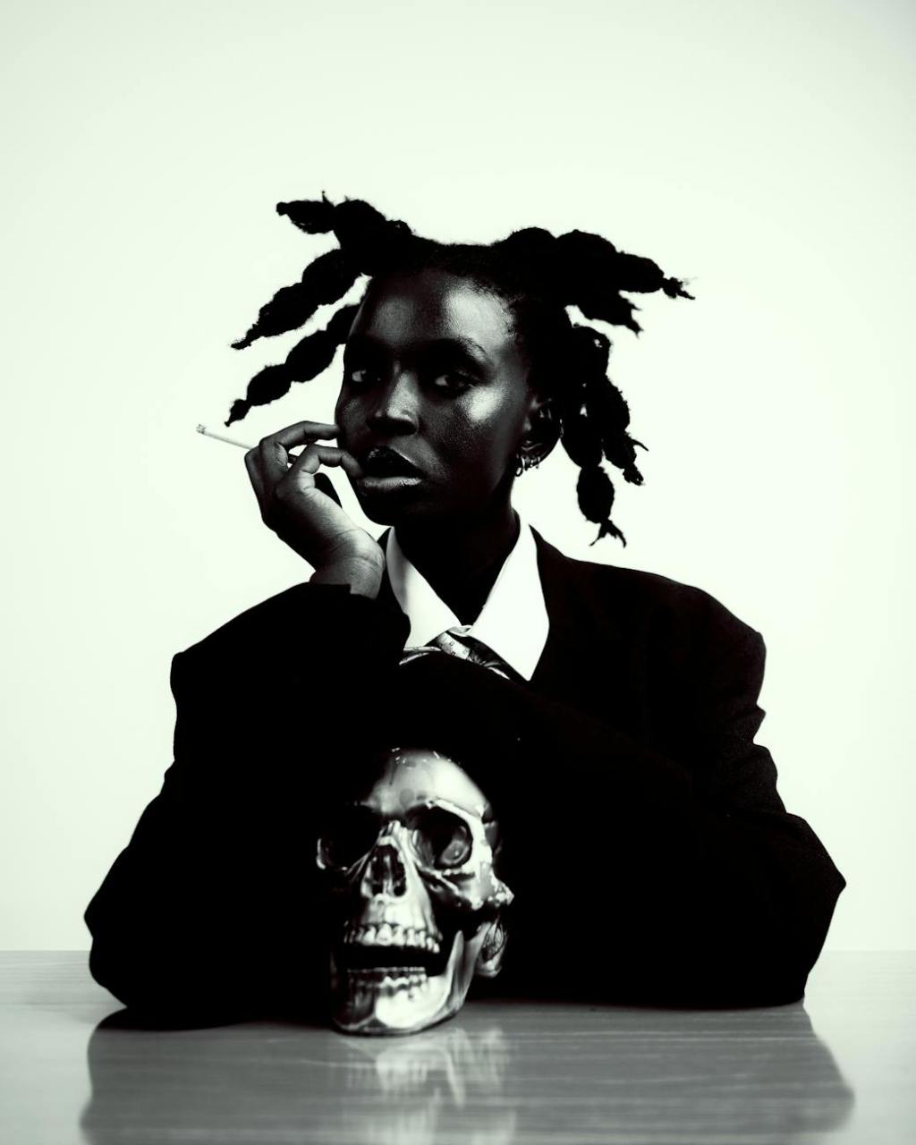 black and white portrait with skull and cigarette