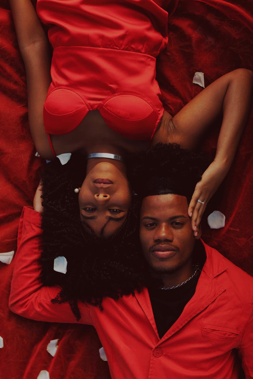 couple dressed in red lying together