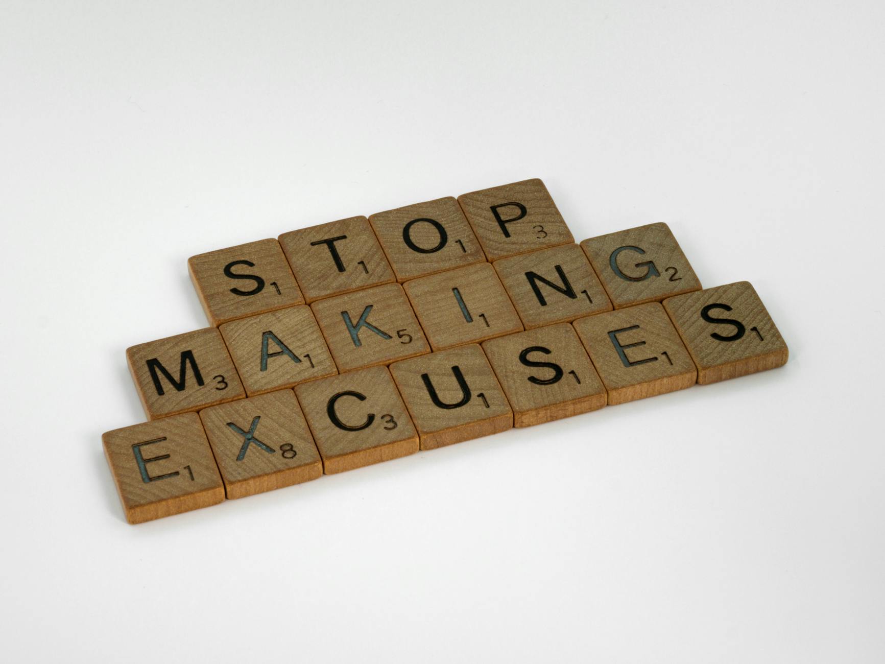 close up shot of scrabble tiles on a white surface