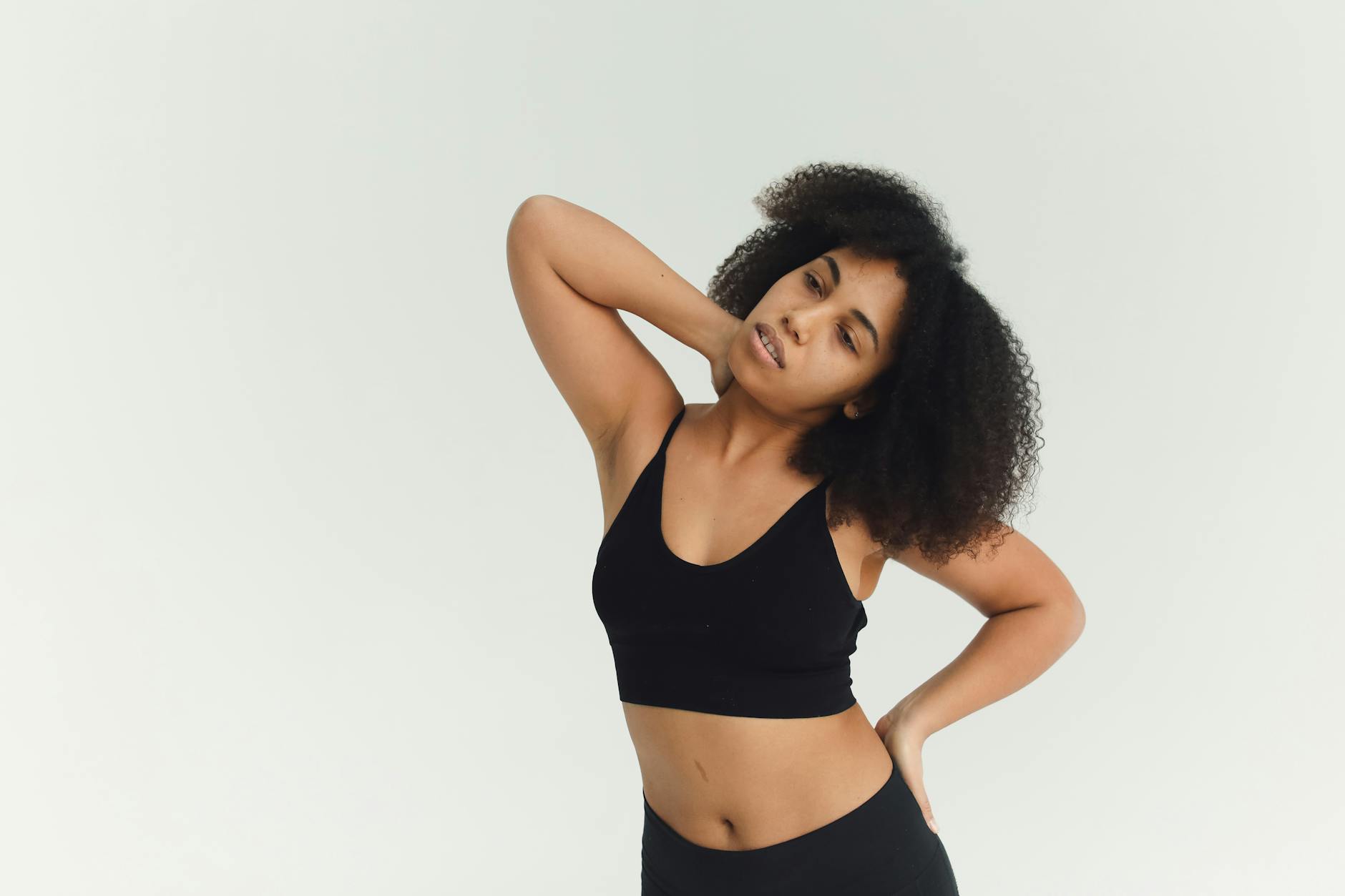 woman in black sports bra and black shorts