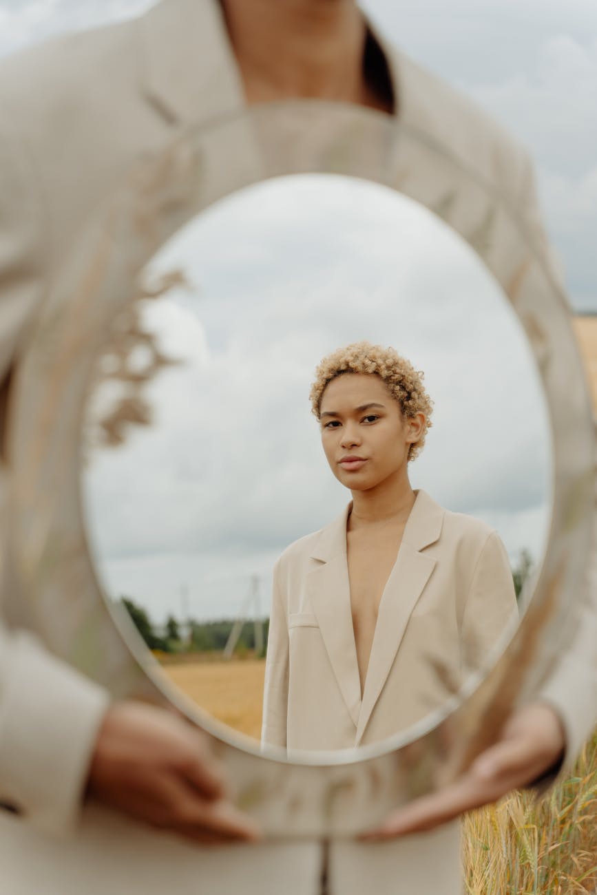 a person holding a mirror